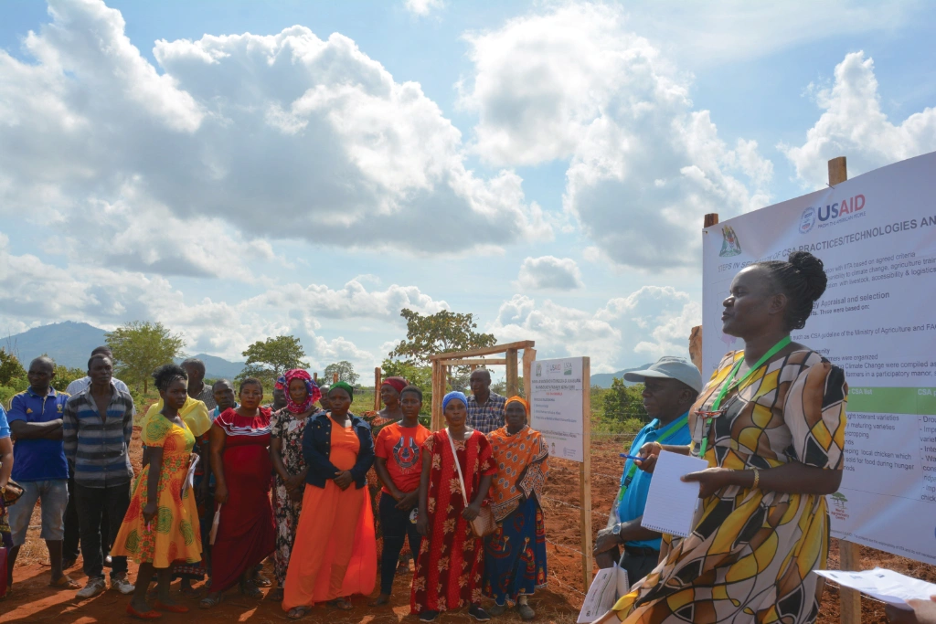 Daina, the District Agriculture Officer (DAICO), explaining the challenges farmers are facing due to climate change Daina, the District Agriculture Officer (DAICO), explaining the challenges farmers are facing due to climate change