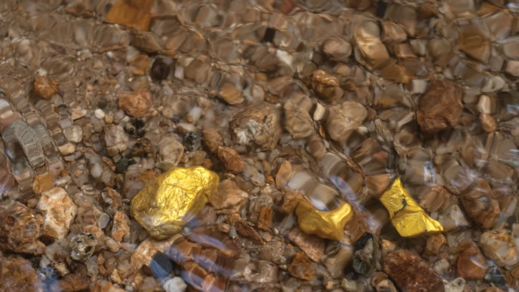 Gold nuggets in a flowing stream