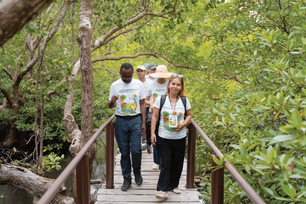 Forest Leaders participants walk through a forest in Bohol Forest Leaders participants walk through a forest in Bohol