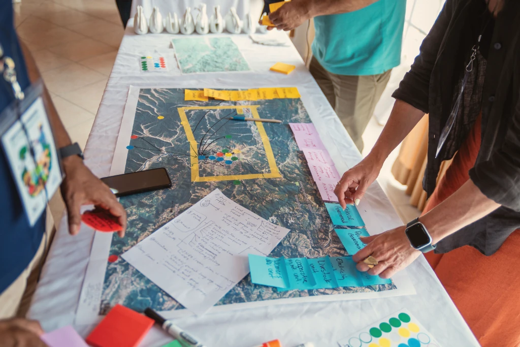workshop participants create a plan for their landscape, working on a map workshop participants create a plan for their landscape, working on a map